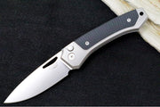 Lionsteel Twain Solid Button Lock Folder - Drop Point Blade / CPM-Magnacut Steel / Gray Titanium Handles with Integral Black G-10 Inlay TWGYGBK - Northwest Knives