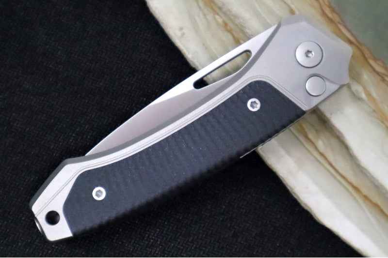 Lionsteel Twain Solid Button Lock Folder - Drop Point Blade / CPM-Magnacut Steel / Gray Titanium Handles with Integral Black G-10 Inlay TWGYGBK