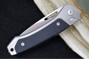 Lionsteel Twain Solid Button Lock Folder - Drop Point Blade / CPM-Magnacut Steel / Gray Titanium Handles with Integral Black G-10 Inlay TWGYGBK - Northwest Knives