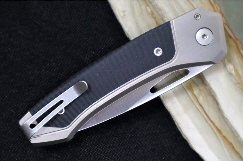 Lionsteel Twain Solid Button Lock Folder - Drop Point Blade / CPM-Magnacut Steel / Gray Titanium Handles with Integral Black G-10 Inlay TWGYGBK - Northwest Knives
