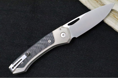 Lionsteel Twain Solid Button Lock Folder - Drop Point Blade / CPM-Magnacut Steel / Gray Titanium Handles with Integral Carbon Fiber Inlay TWGYCF