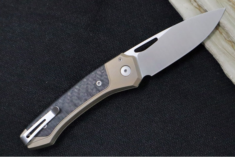 Lionsteel Twain Solid Button Lock Folder - Drop Point Blade / CPM-Magnacut Steel / Bronzed Titanium Handles with Integral Carbon Fiber Inlay TWBRCF