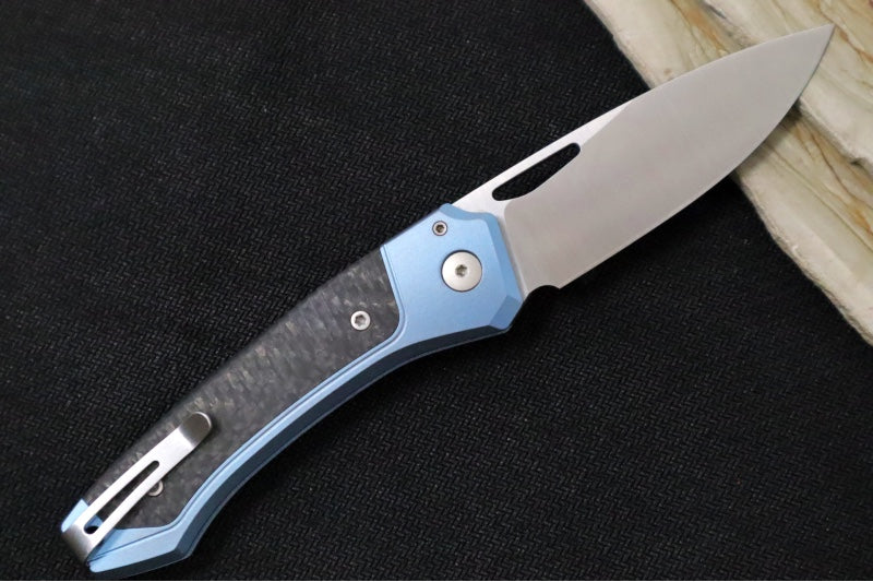 Lionsteel Twain Solid Button Lock Folder - Drop Point Blade / CPM-Magnacut Steel / Blue Titanium Handles with Integral Carbon Fiber Inlay TWBLCF