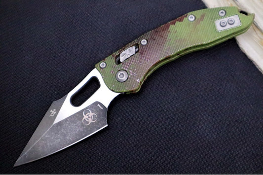 Microtech Stitch RAM-Lock Manual Outbreak - Spear Point Blade / Darkwash Outbreak Finish / Outbreak Green Anodized Aluminum with Blood Splatter 169RL-1FLOBS