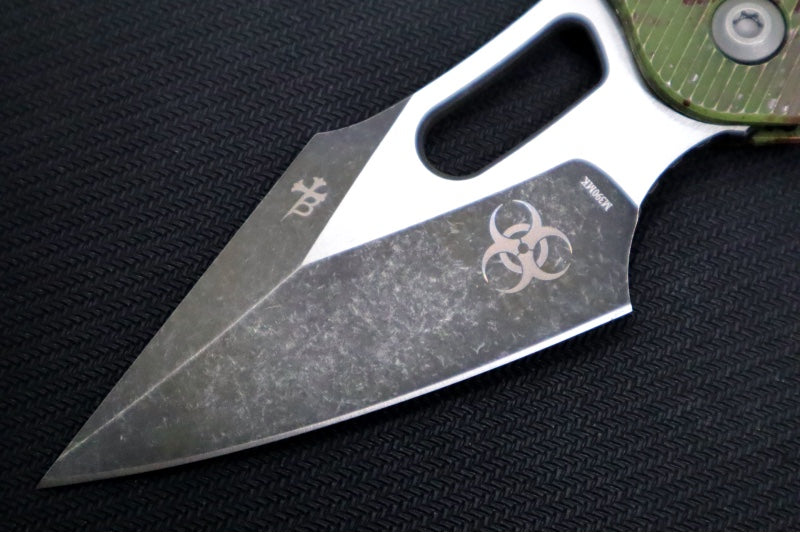 Microtech Stitch RAM-Lock Manual Outbreak - Spear Point Blade / Darkwash Outbreak Finish / Outbreak Green Anodized Aluminum with Blood Splatter 169RL-1FLOBS