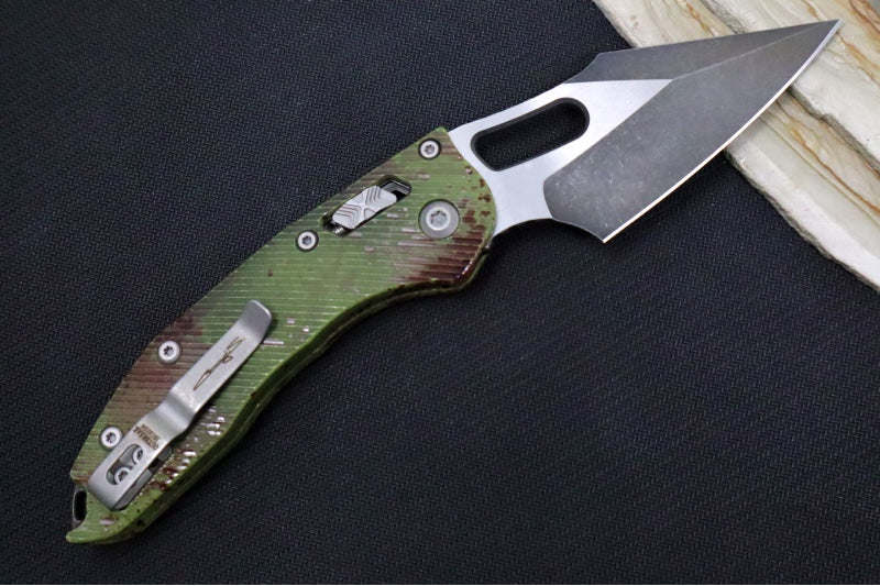 Microtech Stitch RAM-Lock Manual Outbreak - Spear Point Blade / Darkwash Outbreak Finish / Outbreak Green Anodized Aluminum with Blood Splatter 169RL-1FLOBS