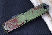 Microtech UTX-85 OTF Gen IV Outbreak Signature Series - Single Edge Blade / Dark Apocalyptic Finish / Green Anodized Aluminum Handle with Blood Splatter 12314-1OBDS - Northwest Knives