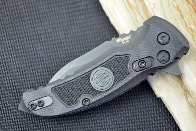 Hogue Knives X1 Microflip Sig Sauer Edition- Solid Black G10 Handle / CPM-154 Blade / Grey Wharncliffe Blade / SIG Medallion 16162