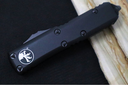 Microtech UTX-85 OTF Tactical - Single Edge with Partial Serrate / Black Finish / Black Body / Black Hardware - 231-2T