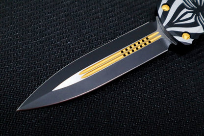 Microtech Hera "Source" Signature Series OTF - Dagger Style / Two-toned Black Blade with Gold Accents / Black Aluminum Handle with "Source" Artwork 702-TSOS