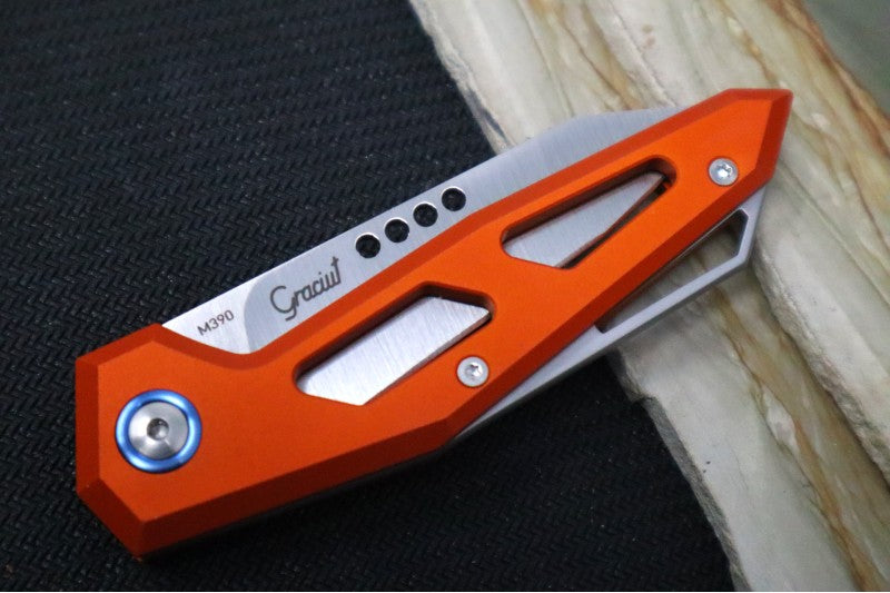 Maniago Knife Makers Edge - Satin Clip Point Blade / M390 Steel / Orange Anodized Aluminum & Blue Accents MK-EG-AOR