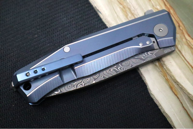 Lionsteel Myto Flipper - Drop Point Blade / Chad Nichols Raindrop Damascus / Blue Anodized Titanium Handle MT01DBL
