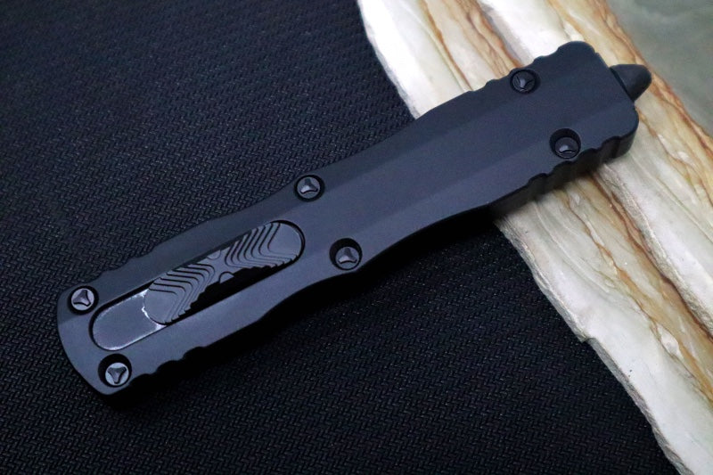 Microtech Dirac Delta Tactical OTF - Black Finish / Fully Serrated Dagger Blade / Black Aluminum Handle 227-3T