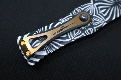 Microtech Hera "Source" Signature Series OTF - Single Edge Style / Two-toned Black Blade with Gold Accents / Black Aluminum Handle with "Source" Artwork 703-TSOS