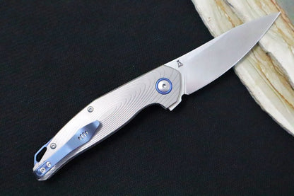 Maniago Knife Makers Goccia - Drop Point Blade / M390 Steel / Sandblasted Titanium Handle / Blue Titanium Backspacer