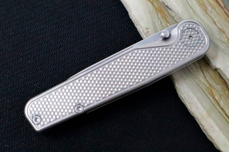 Tactile Turn Rockwall Thumbstud - Textured Titanium Handle / Magnacut Steel / Drop Point Blade