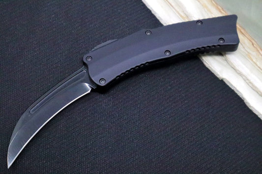 Heretic Knives Iconoclast ROC OTF - Black Anodized Aluminum Handle / Black DLC Finished Blade / Hand Ground Hawkbill / Black Dunes Fat Carbon Fiber Button