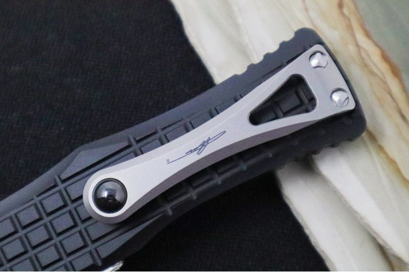 Microtech Hera Signature Series OTF - Stonewashed Finish / Single Edge Style / Black Aluminum Handle with Frag Pattern 703-10FRS