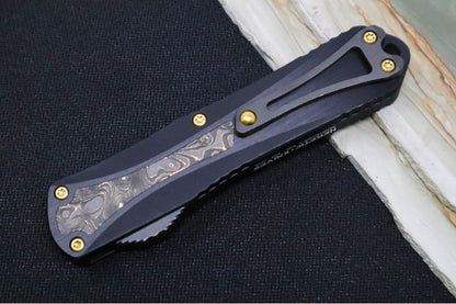 Heretic Knives Manticore E OTF - Black DLC Finish / Dagger Blade / Black Anodized Aluminum & Gold Dunes Fat Carbon Fiber Handle H028-6A-FC/TiN