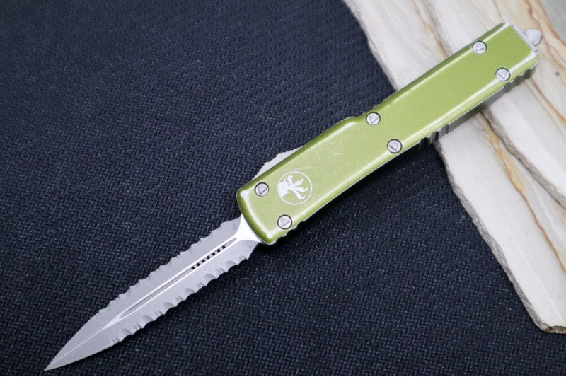 Microtech UTX-70 OTF - Distressed OD Green Handle / Apocalyptic Finish / Dagger Full Serrated Blade 147-D12DOD