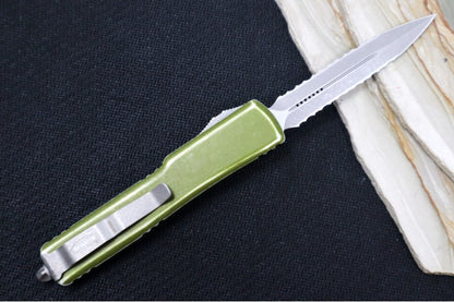 Microtech UTX-70 OTF - Distressed OD Green Handle / Apocalyptic Finish / Dagger Full Serrated Blade 147-D12DOD