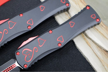 Microtech Hera OTF "TWIN FLAMES" - Double Edge / Black & Red Blade / Black Aluminum Handle with Hearts 702-1SETTFS