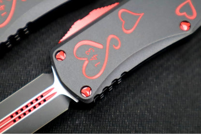 Microtech Hera OTF "TWIN FLAMES" - Double Edge / Black & Red Blade / Black Aluminum Handle with Hearts 702-1SETTFS