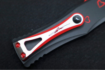 Microtech Hera OTF "TWIN FLAMES" - Double Edge / Black & Red Blade / Black Aluminum Handle with Hearts 702-1SETTFS